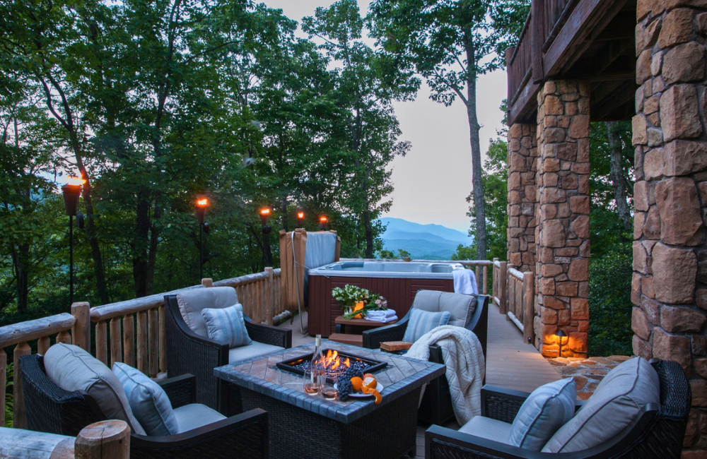 luxury deck with firepit and lights at sunset  Greybeard Vacation Rentals