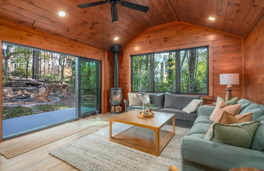 spacious light-filled living room in modern cabin in the woods  Greybeard Vacation Rentals