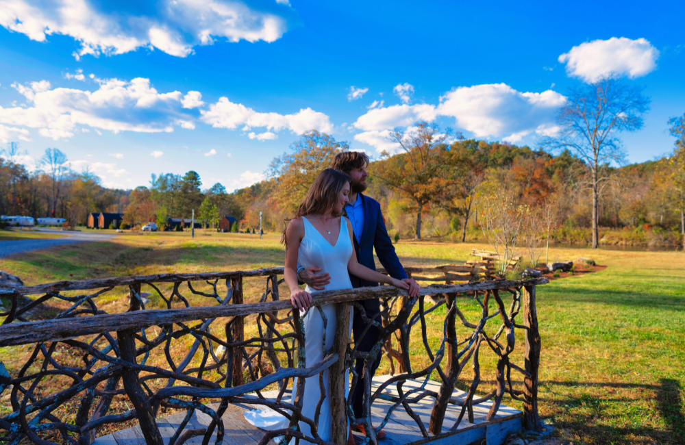Asheville-River-Cabins wedding couple at bridge