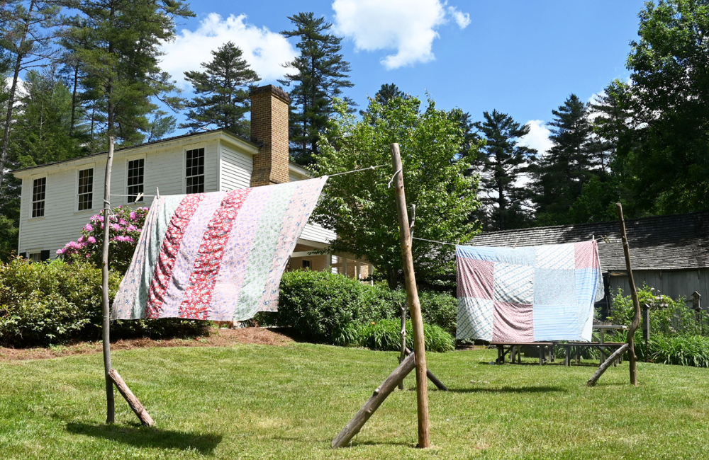 Photo of quilts blowing in the breeze 