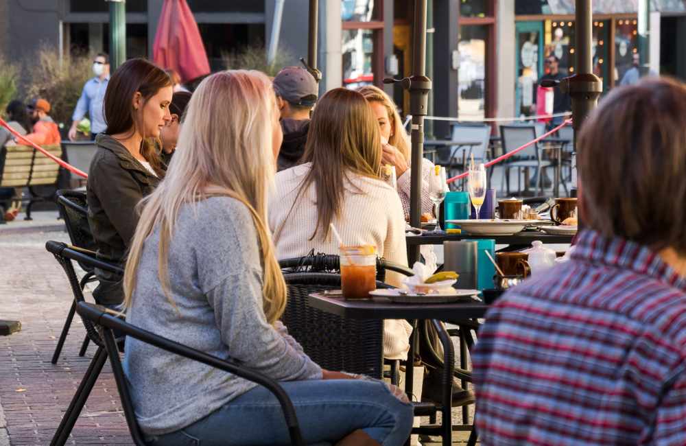 People dining outdoors on a patio