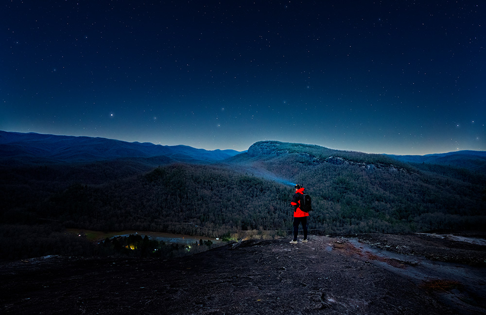 Man stargazing in the mountains