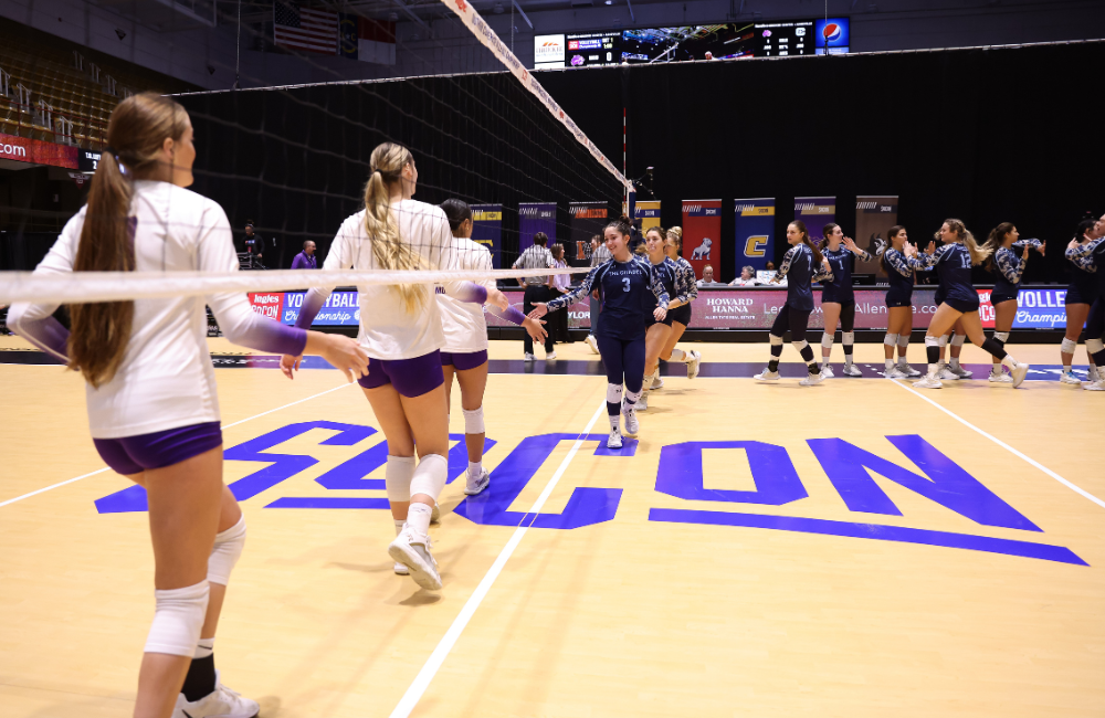 Teams meeting on the court at a volleyball tournament