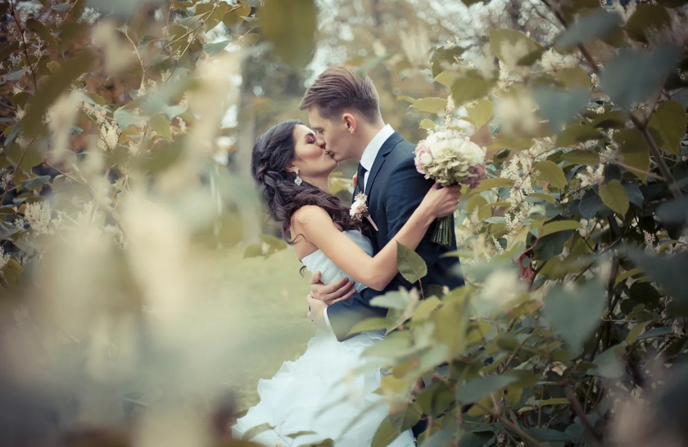 Kissing wedding couple