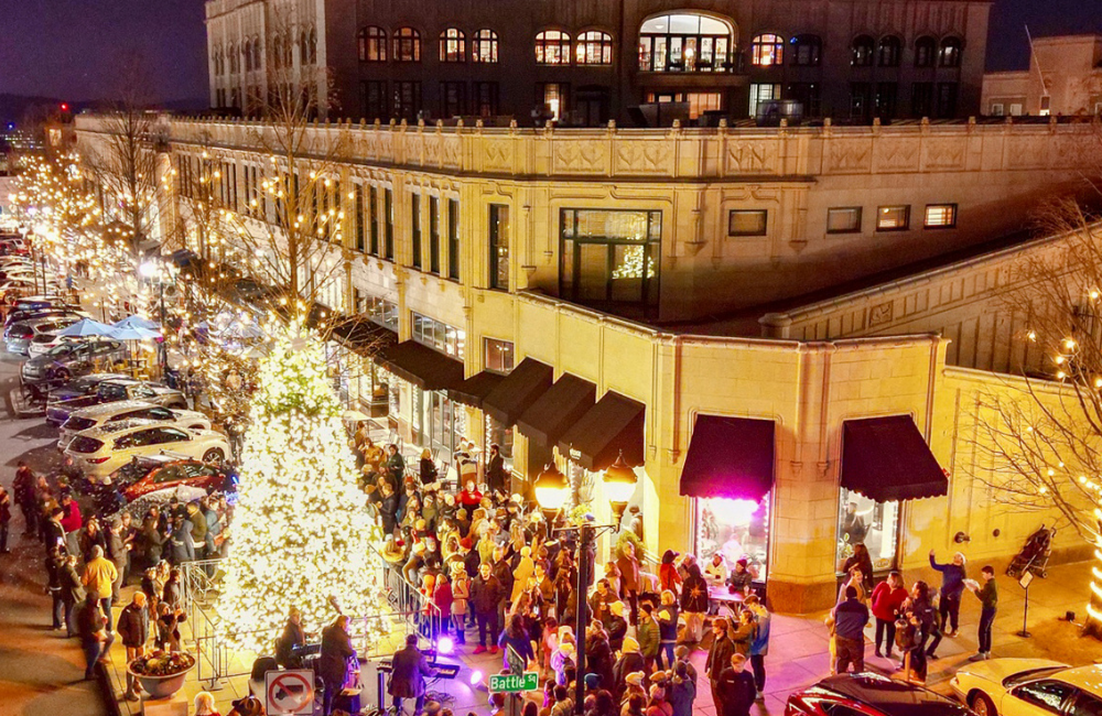 Downtown Asheville Christmas scene of the lit outdoor Christmas tree at the Grove Arcade
