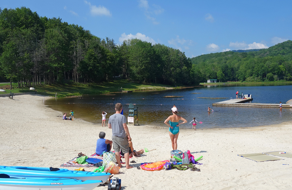 Beachgoers and swimmers at Wildcat Lake Banner Elk NC
