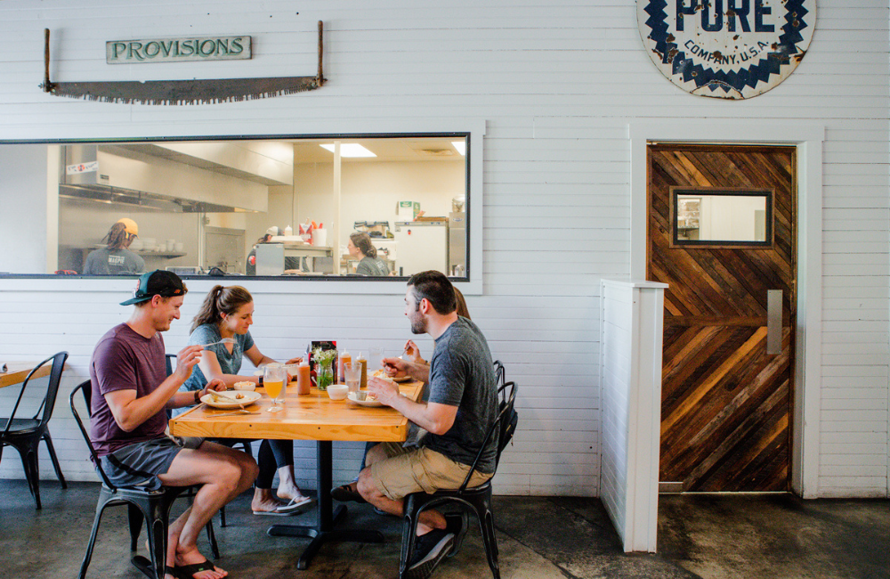Brevard NC four people dining at a casual restaurant