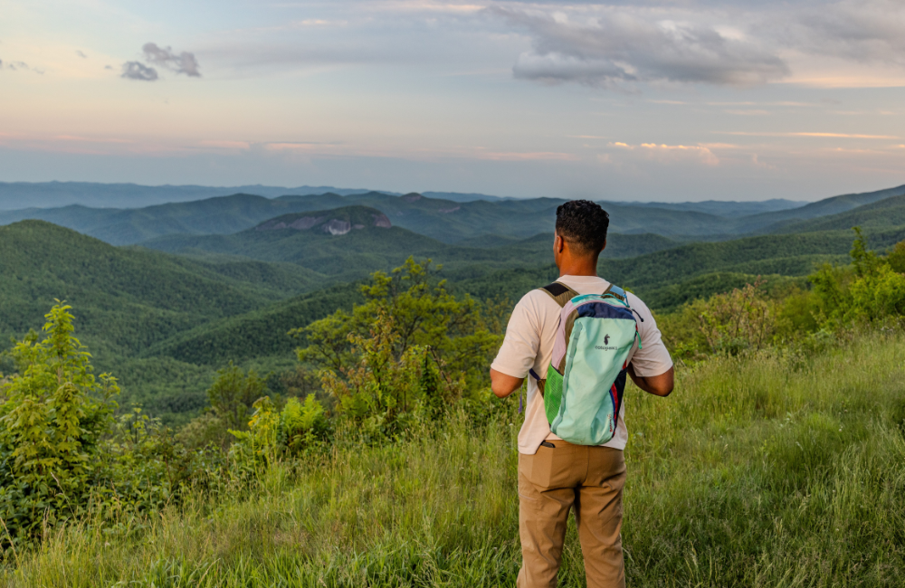 Brevard NC mountain vistas being viewed by a man hiking alone