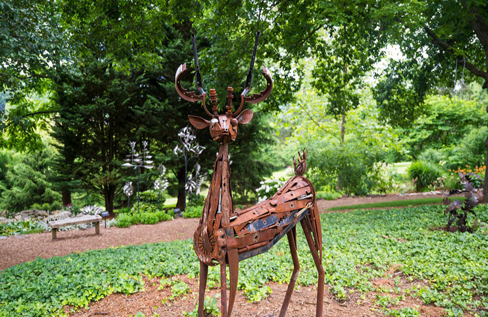 Sculpture of a deer outdoors at Grovewood Village and Gallery