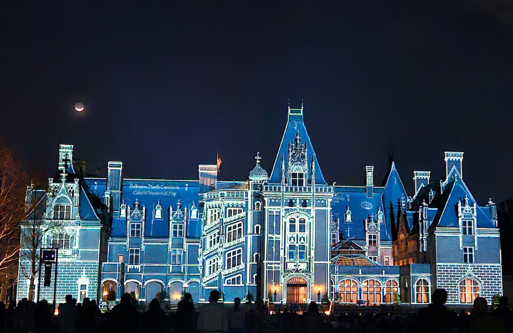 Projected light transforms the facade of the Biltmore House during the Luminere experience