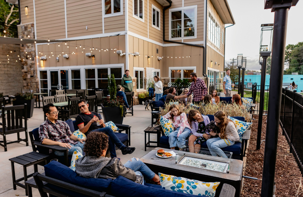 People enjoying outdoor dining at Lantern Lodge Asheville