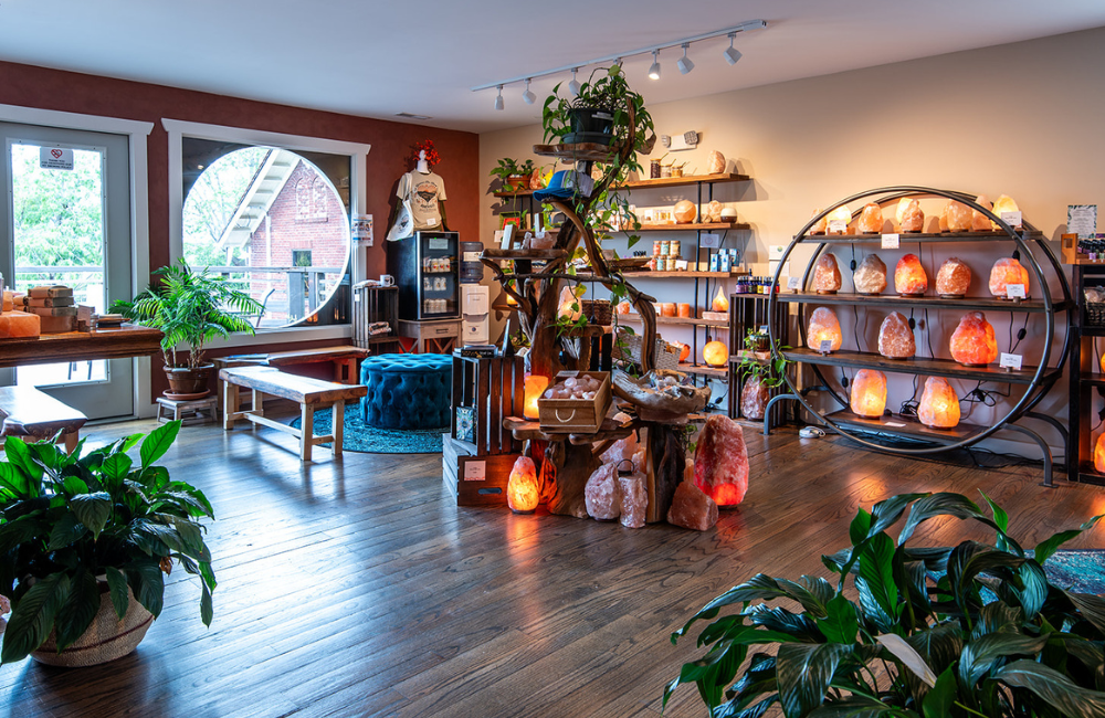A spacious shop area with salt and handmade goods on shelves