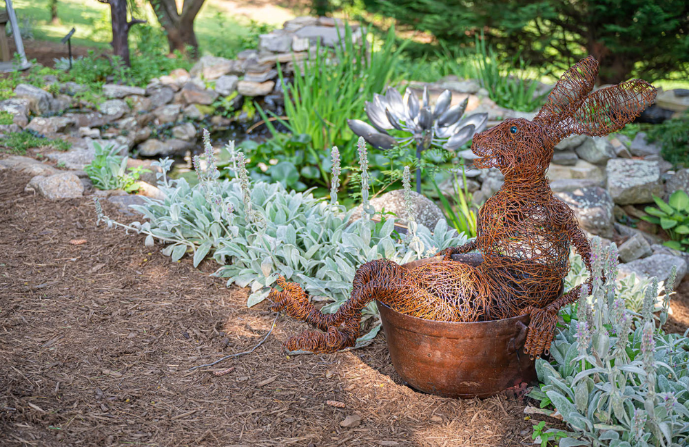 Grovewood Village rabbit sculpture in garden