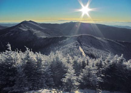 Sun over the winter mountains