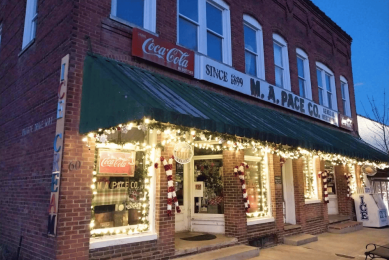 Storefront with lights at Hometown Christmas, Saluda